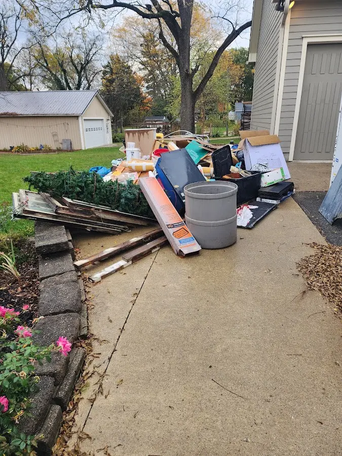 Dumpster being loaded with debris for Demolition Dumpster Rental in Salina